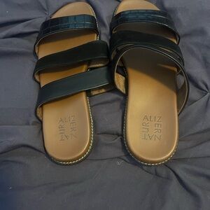 New without box. Naturalizer Black slip on sandal in black leather.